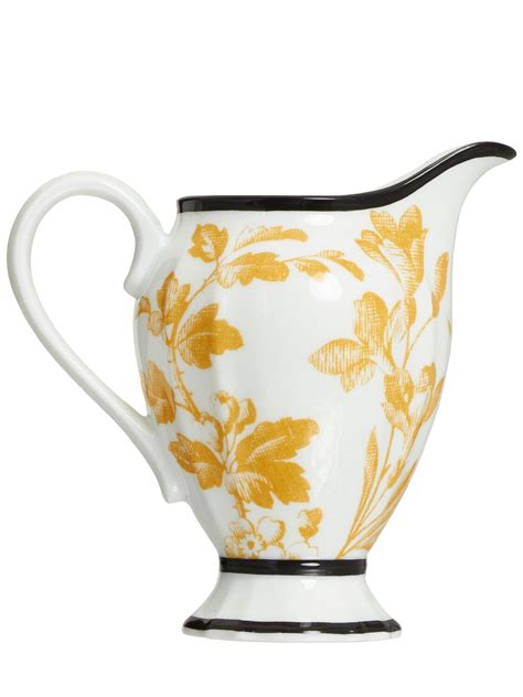 Herbarium creamer in yellow porcelain 